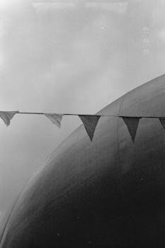 Monochrome image of bunting against a large dome structure in Montreal.