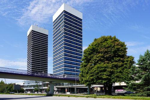 Free Contemporary office towers in the vibrant district of Hamburg under a clear blue sky. Stock Photo