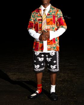 A colorful fusion of traditional and modern fashion styles in a striking ensemble.