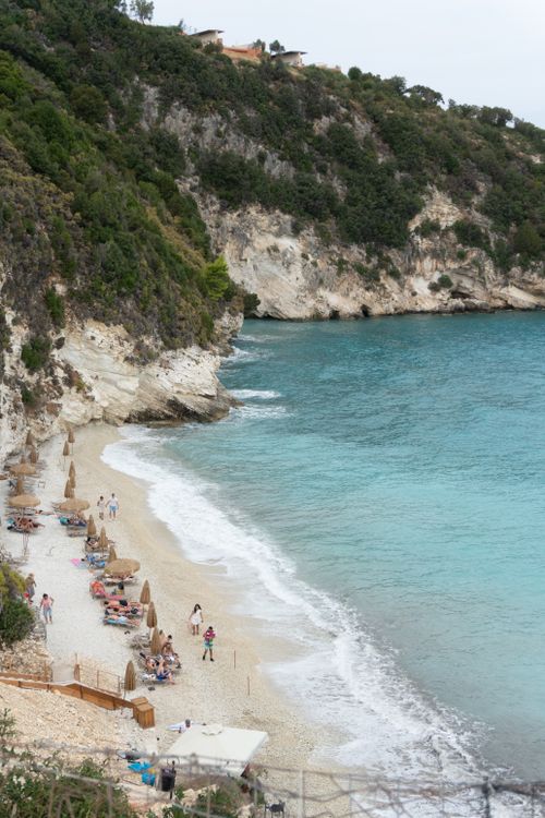 Free Serene beach in Zakynthos, Greece with clear waters and lush cliffs. Stock Photo