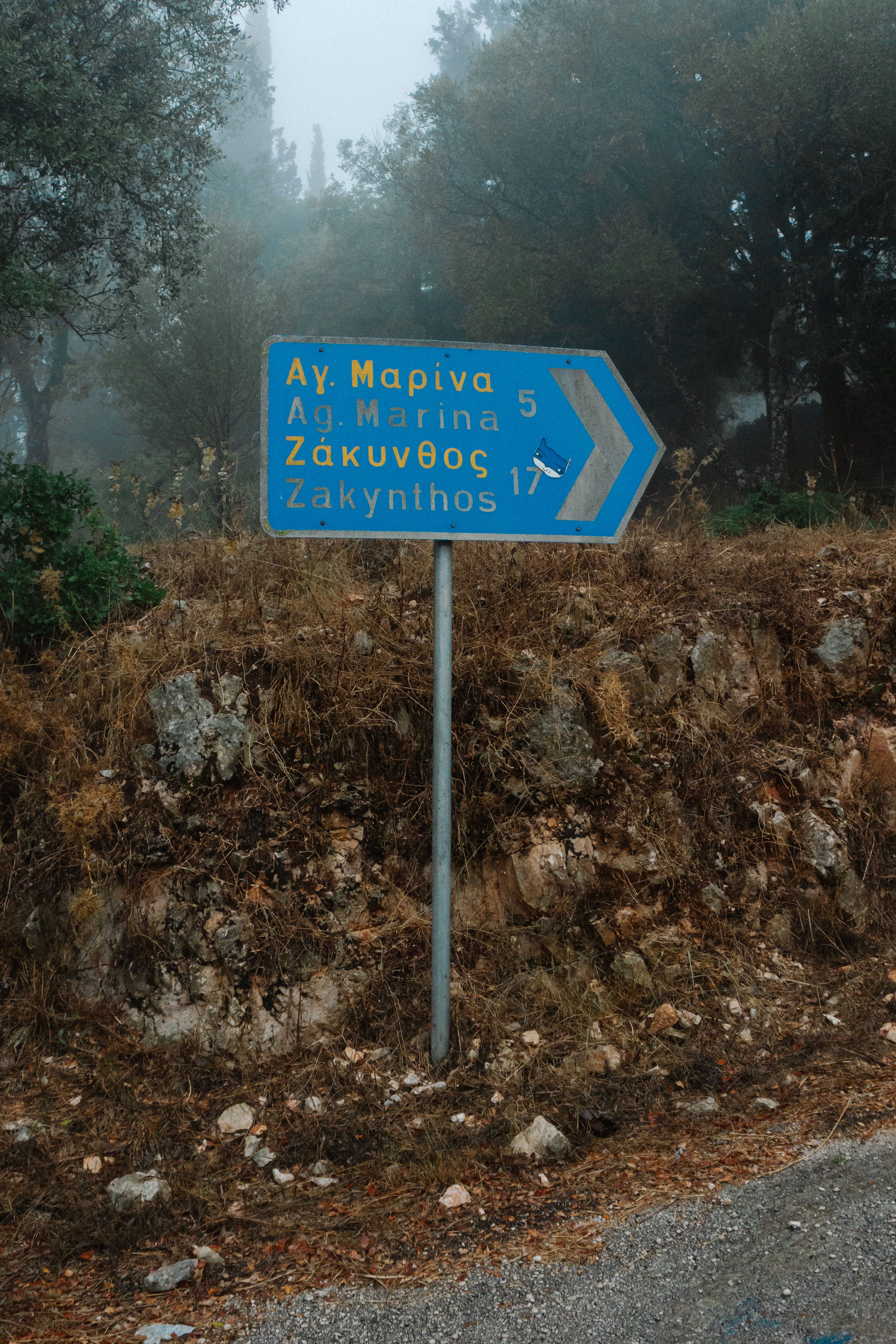Signpost on Zakynthos Island in Foggy Landscape