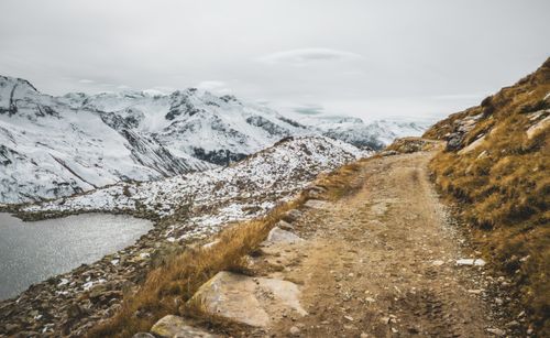 Free Breathtaking winter view of snowy mountains and trail in Andermatt, Switzerland. Stock Photo