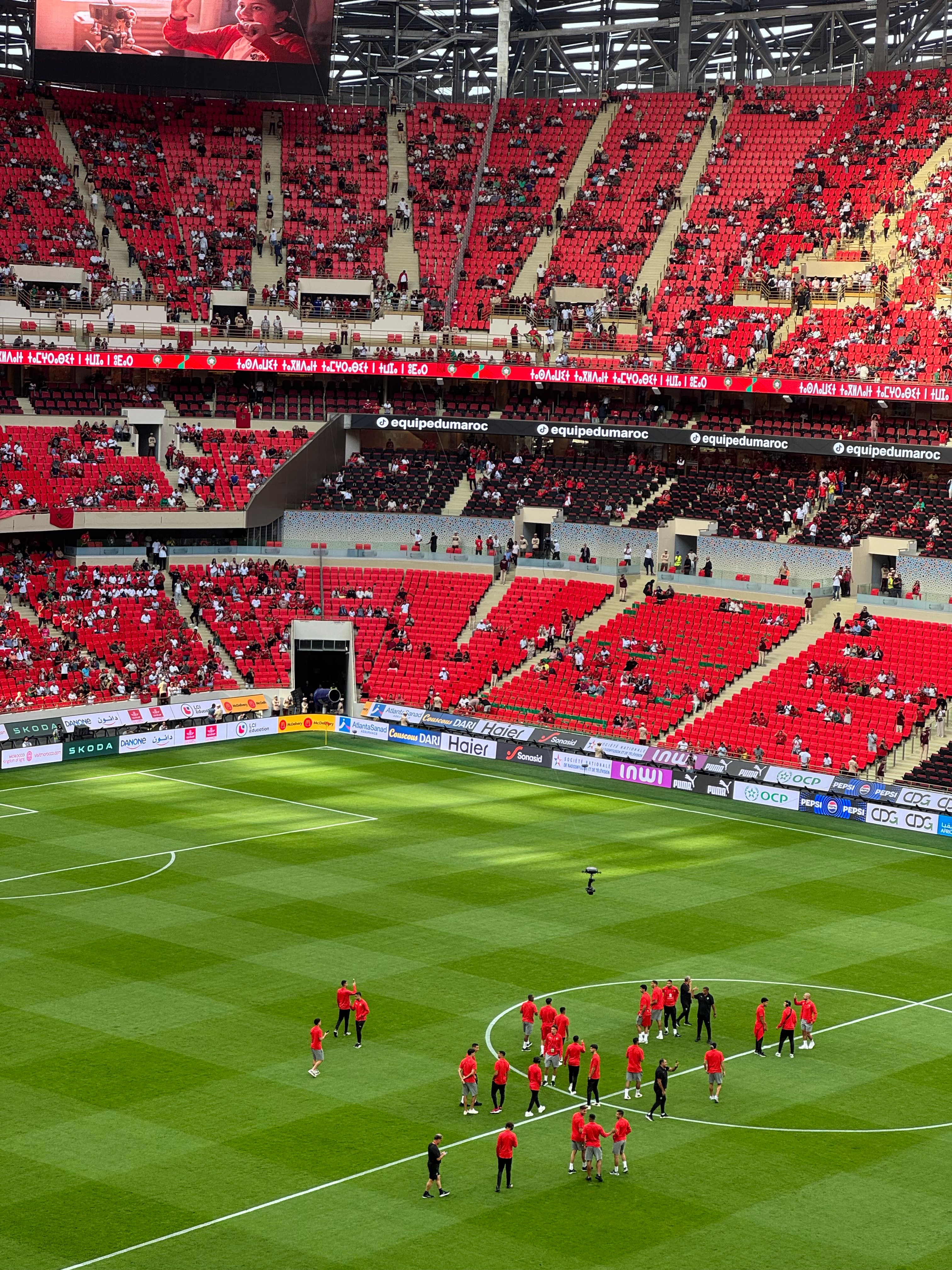 Lively Football Match in Red Stadium