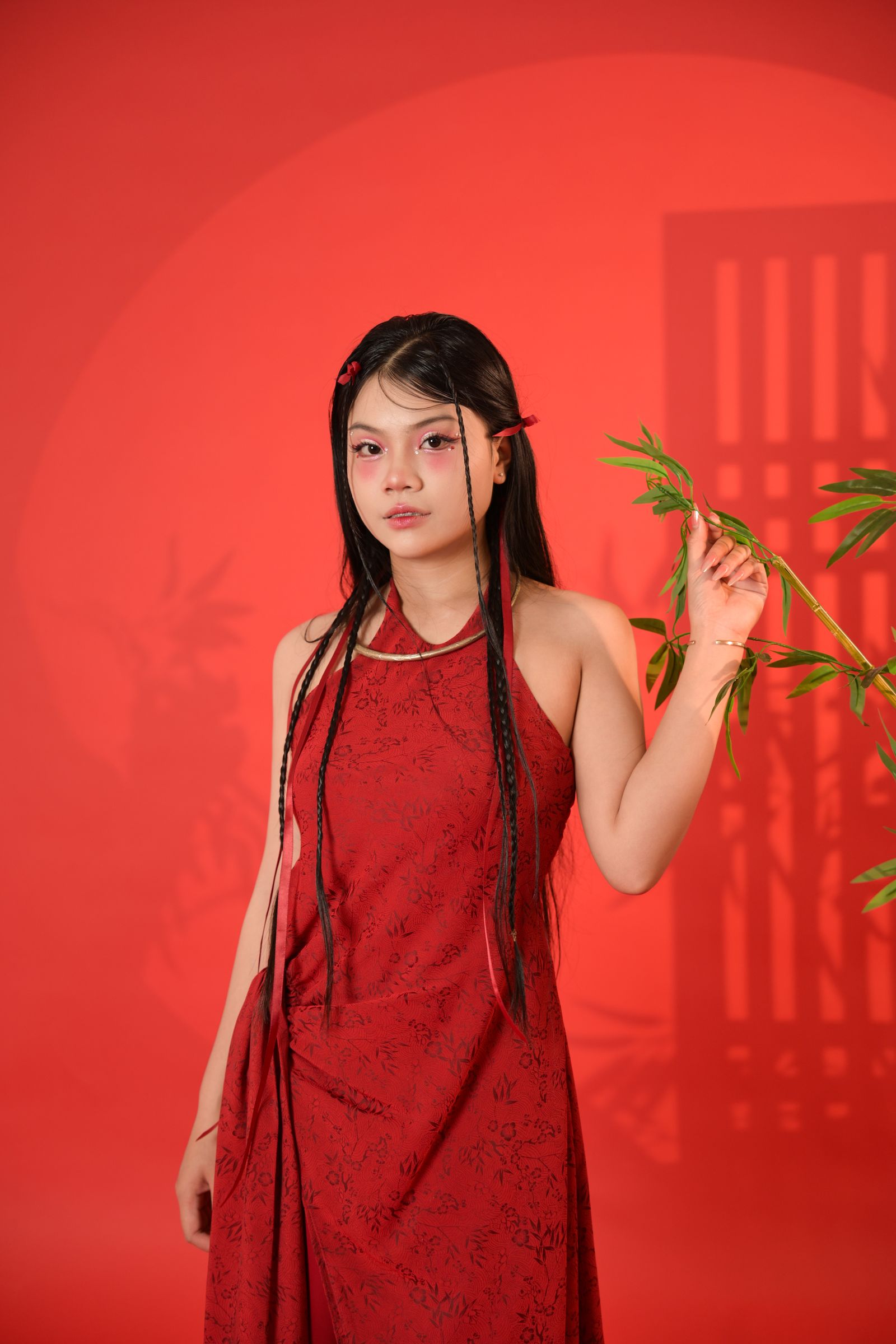 elegant woman in deep red satin dress portrait