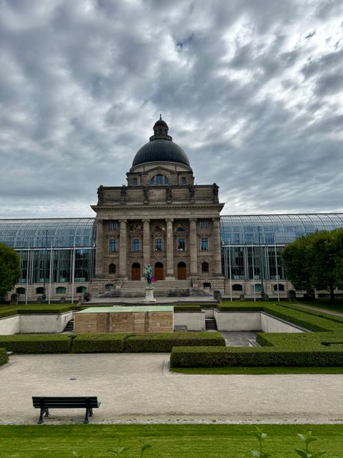 Free View of the Bavarian State Chancellery in Munich with dramatic clouds overhead. Stock Photo