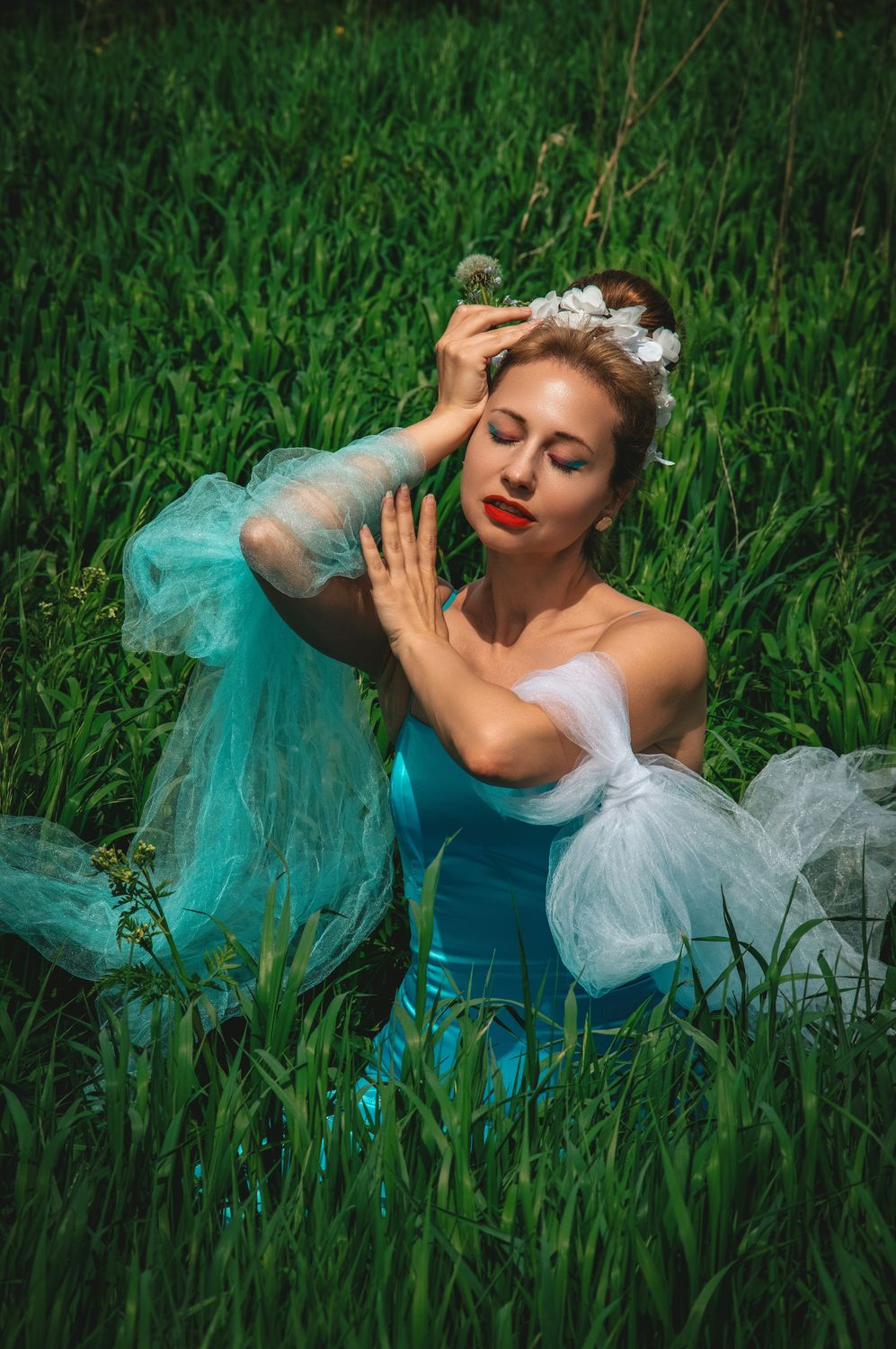 Elegant Woman in Blue Gown Posing in Lush Green Field · Free Stock Photo