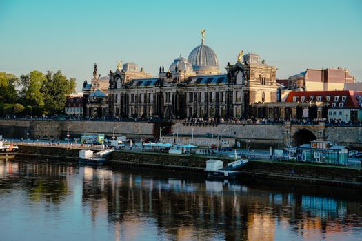 Beautiful view of a historic building along the river in Dresden, Germany, during the day.