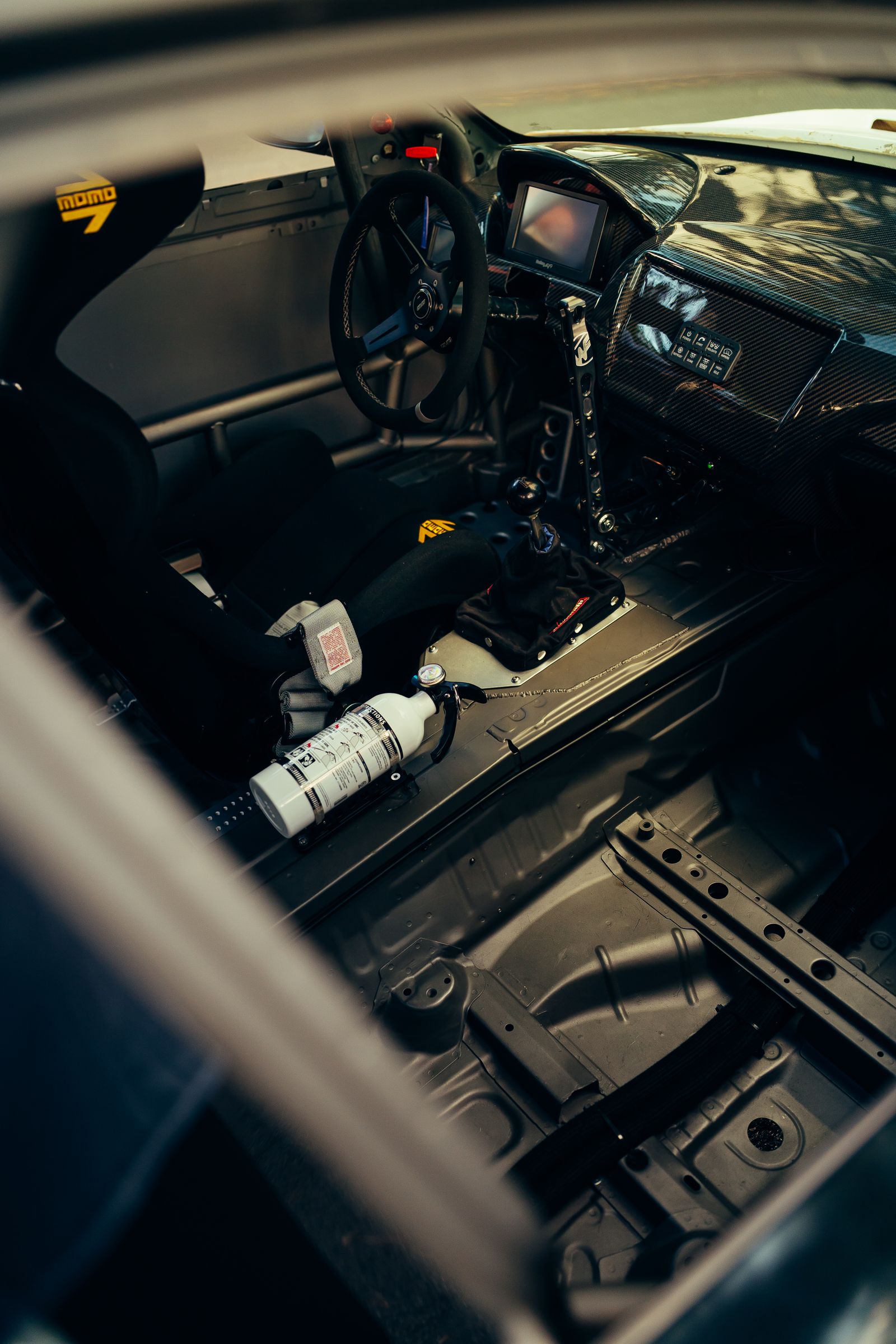 Performance car interior with steering wheel and dashboard