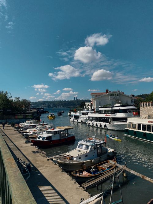 Free A picturesque scene of boats docked along the Bosphorus in Istanbul under a clear blue sky. Stock Photo