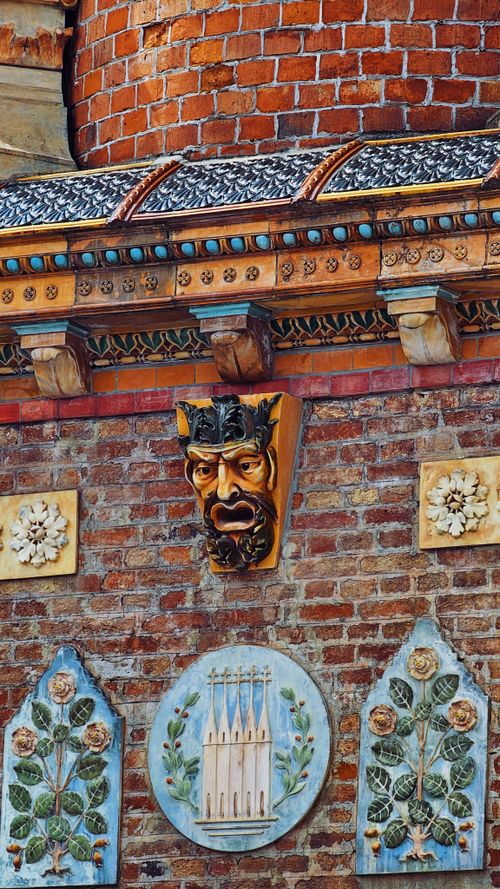 Free Detail of Zsolnay ceramics on a historic Hungarian building facade in Pécs, featuring ornamental artistry. Stock Photo