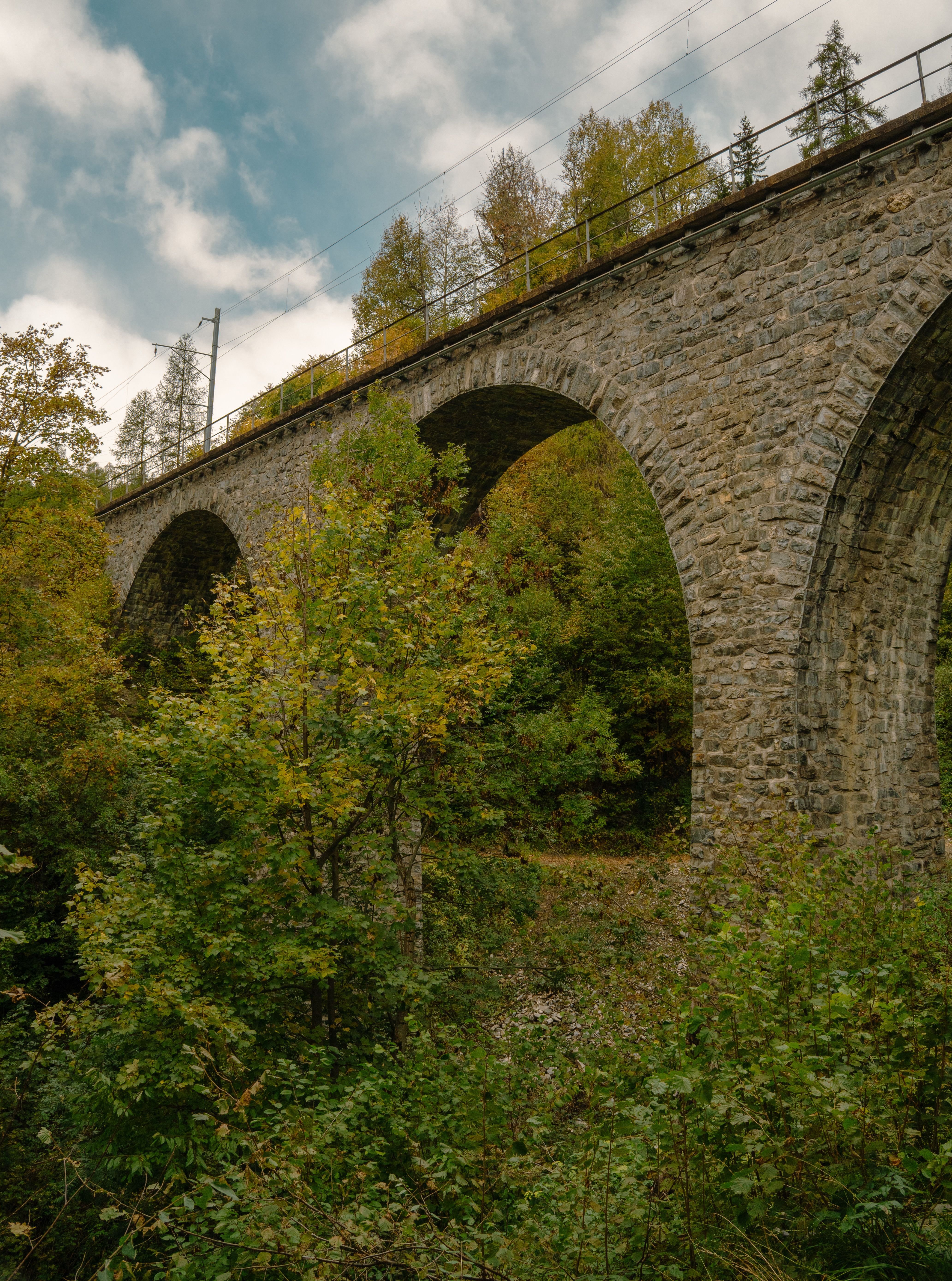 Rustic Stone Railway Bridge in Autumn Forest · Free Stock Photo