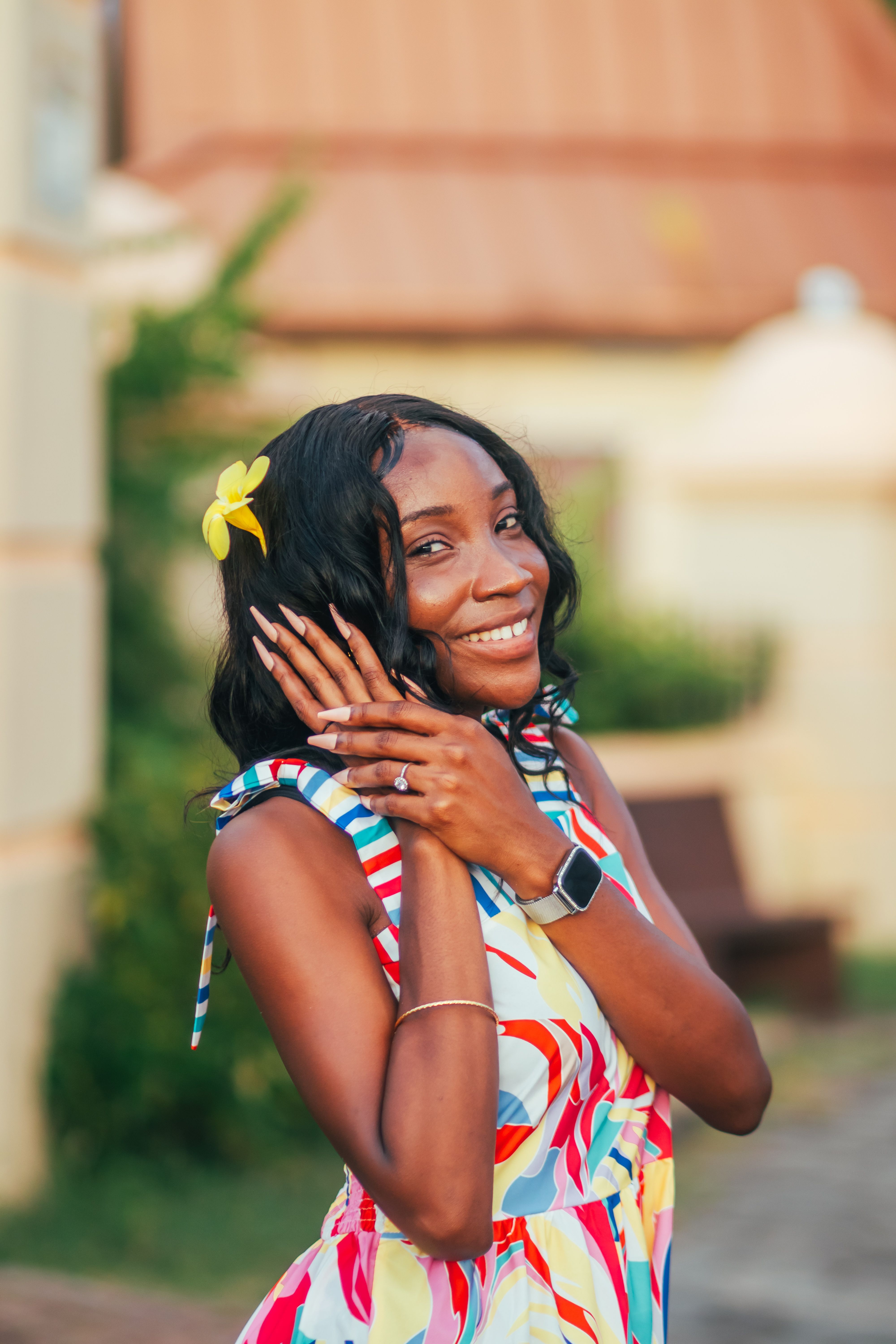 Smiling Woman in Colorful Summer Dress Outdoors  Free Stock Photo