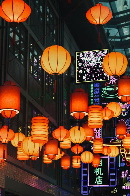 Colorful Chinese lanterns illuminate Dubai's vibrant nightscape, blending tradition and modernity.