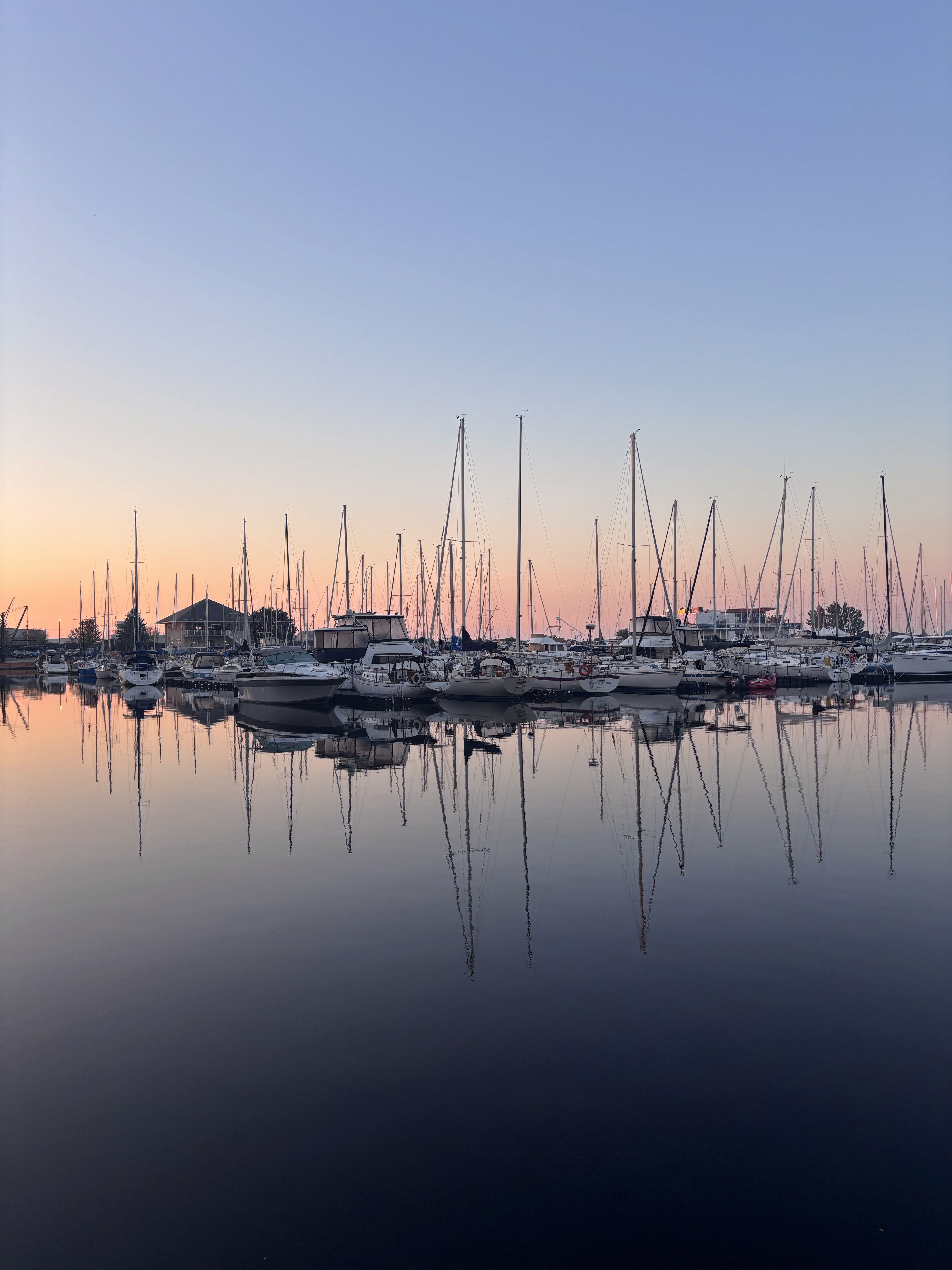 Serene Marina Sunrise with Reflections · Free Stock Photo