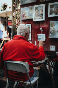 An artist in Montmartre, Paris, paints charming street scenes. Captured in vibrant detail.