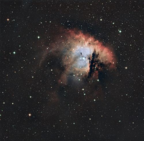 Free A striking view of the Pacman Nebula showcasing its vibrant colors and starry backdrop. Stock Photo