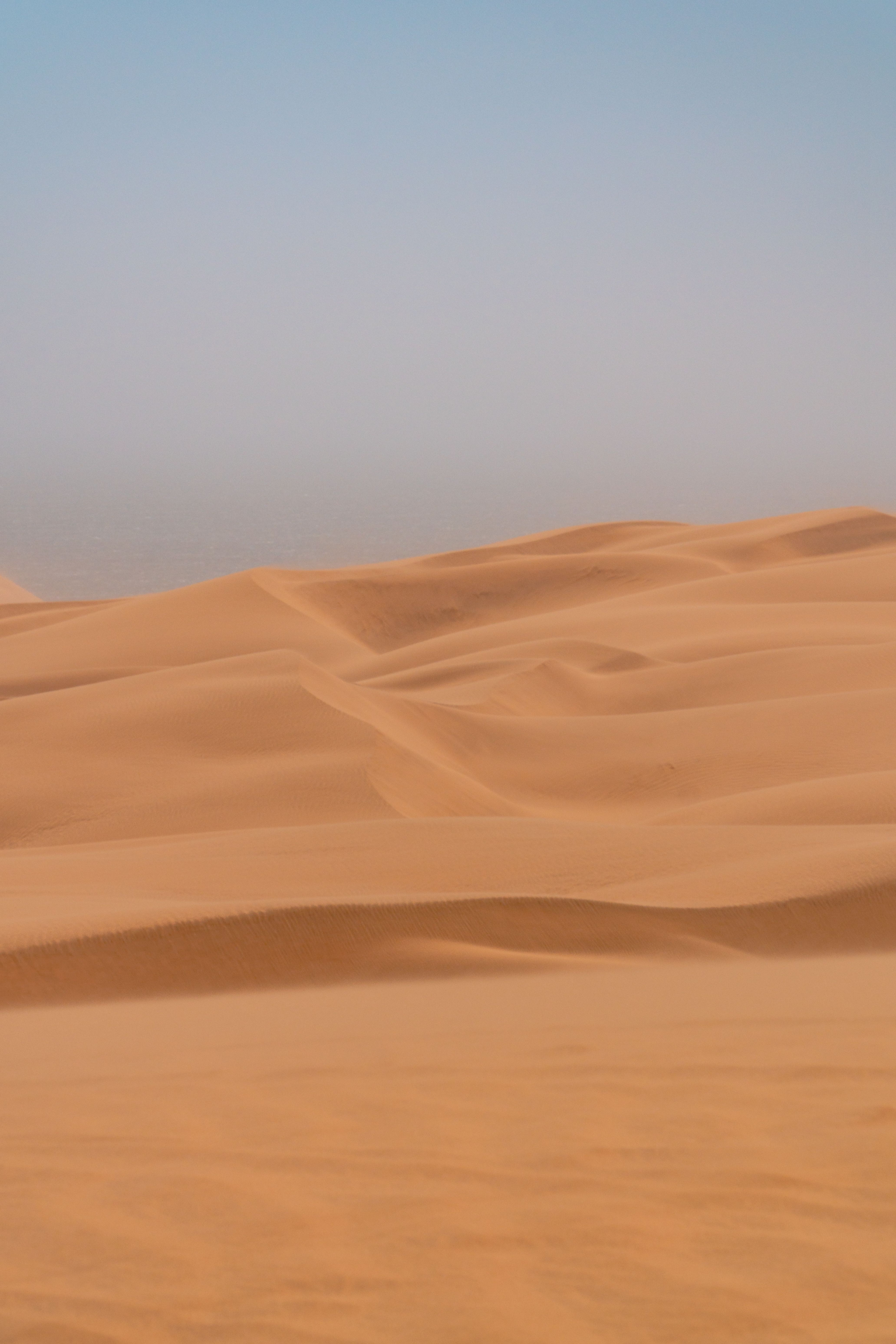 Golden Sand Dunes Under Clear Blue Sky · Free Stock Photo