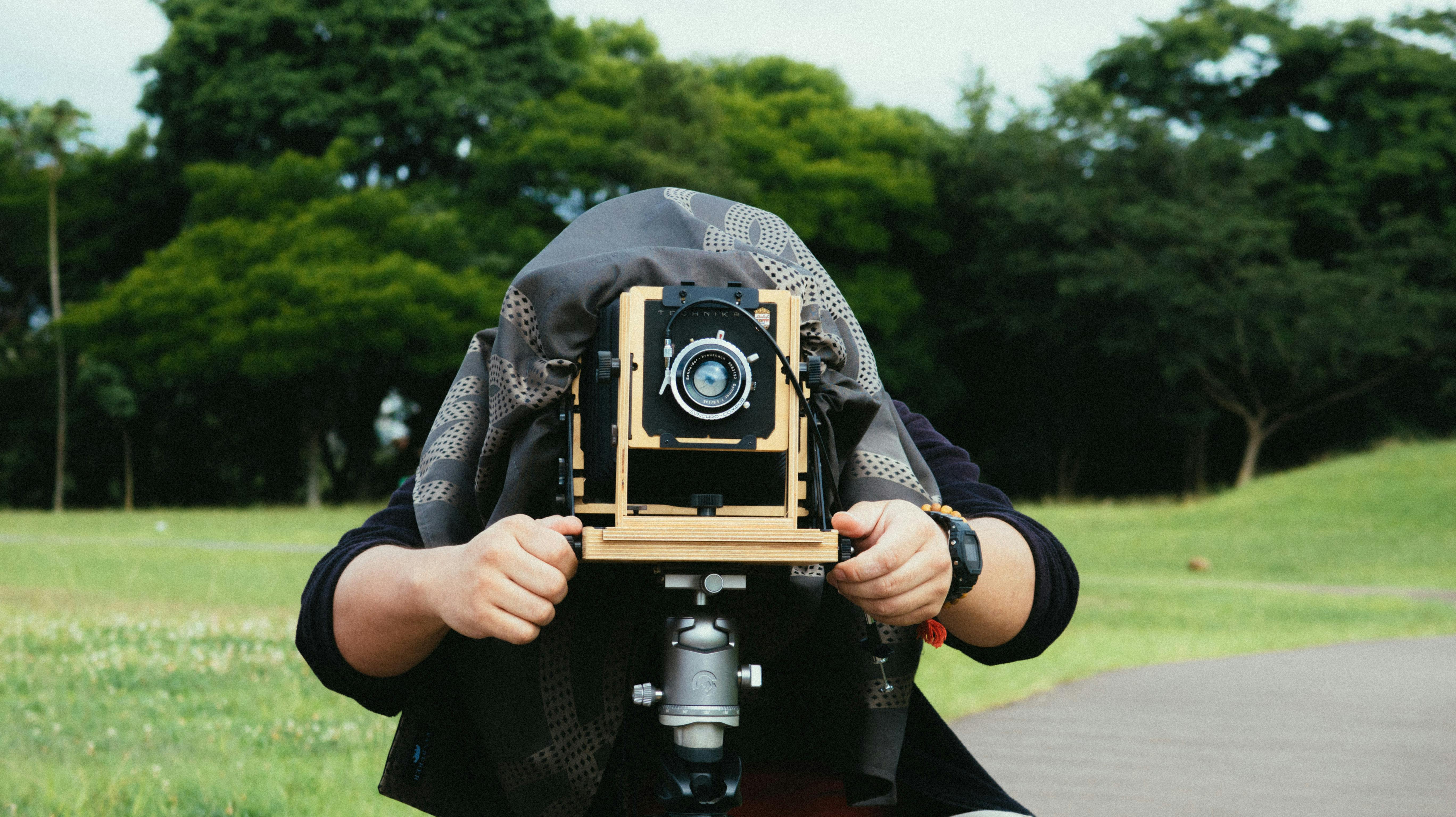 photo of man person standing behind camera