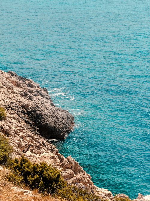 Free Beautiful rocky coastline of Krk, Croatia with clear blue waters perfect for travel inspiration. Stock Photo