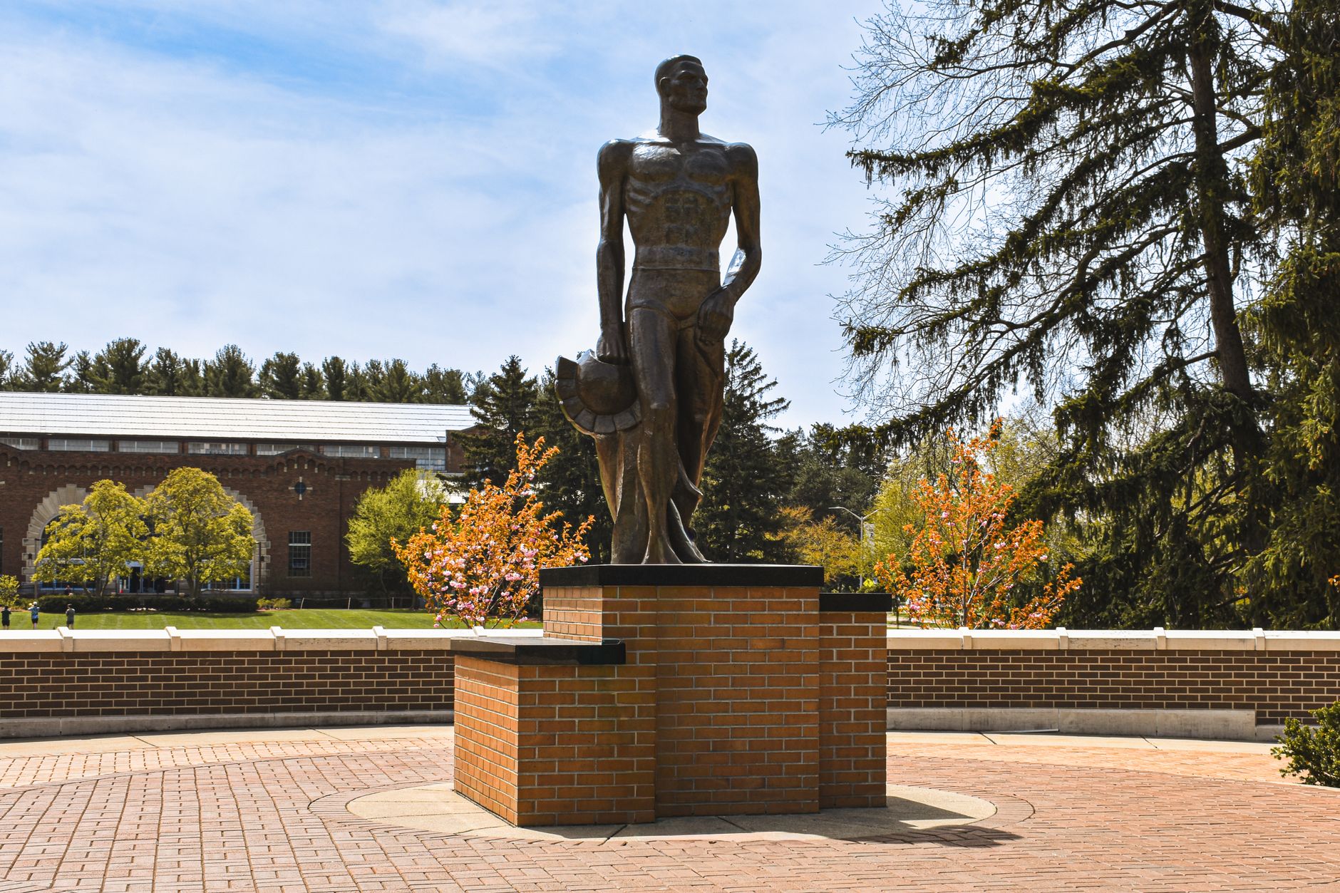Bronze Spartan statue under a clear spring sky on Michigan State University campus, East Lansing.