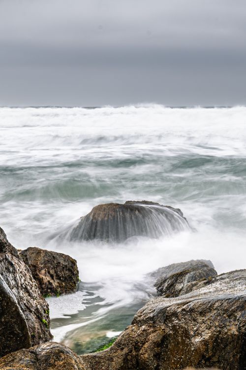 Free Capture the ethereal beauty of Brazilian coastal waves crashing over rugged rocks. Stock Photo