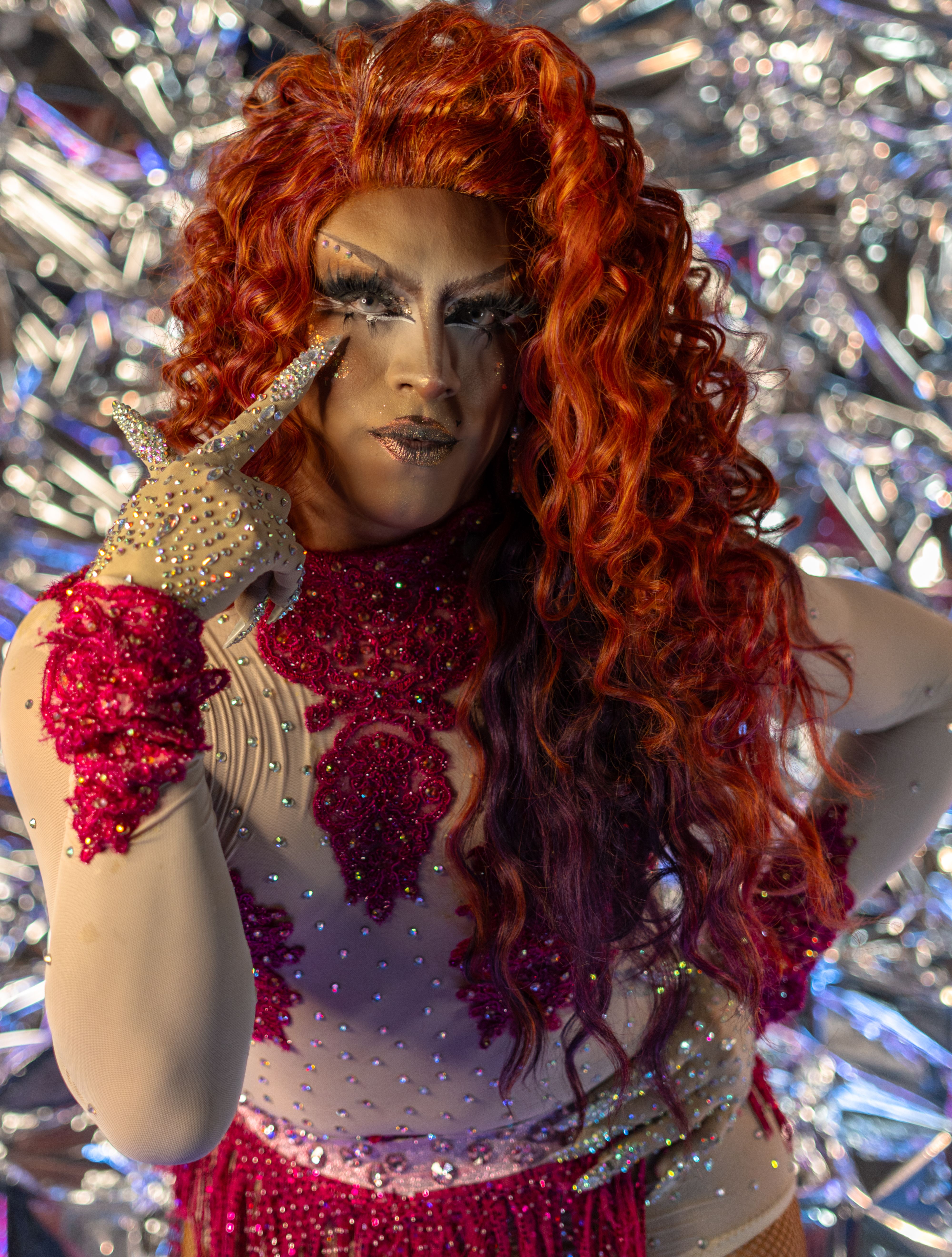 Glamorous Drag Queen with Red Curls on Metallic Background · Free Stock ...