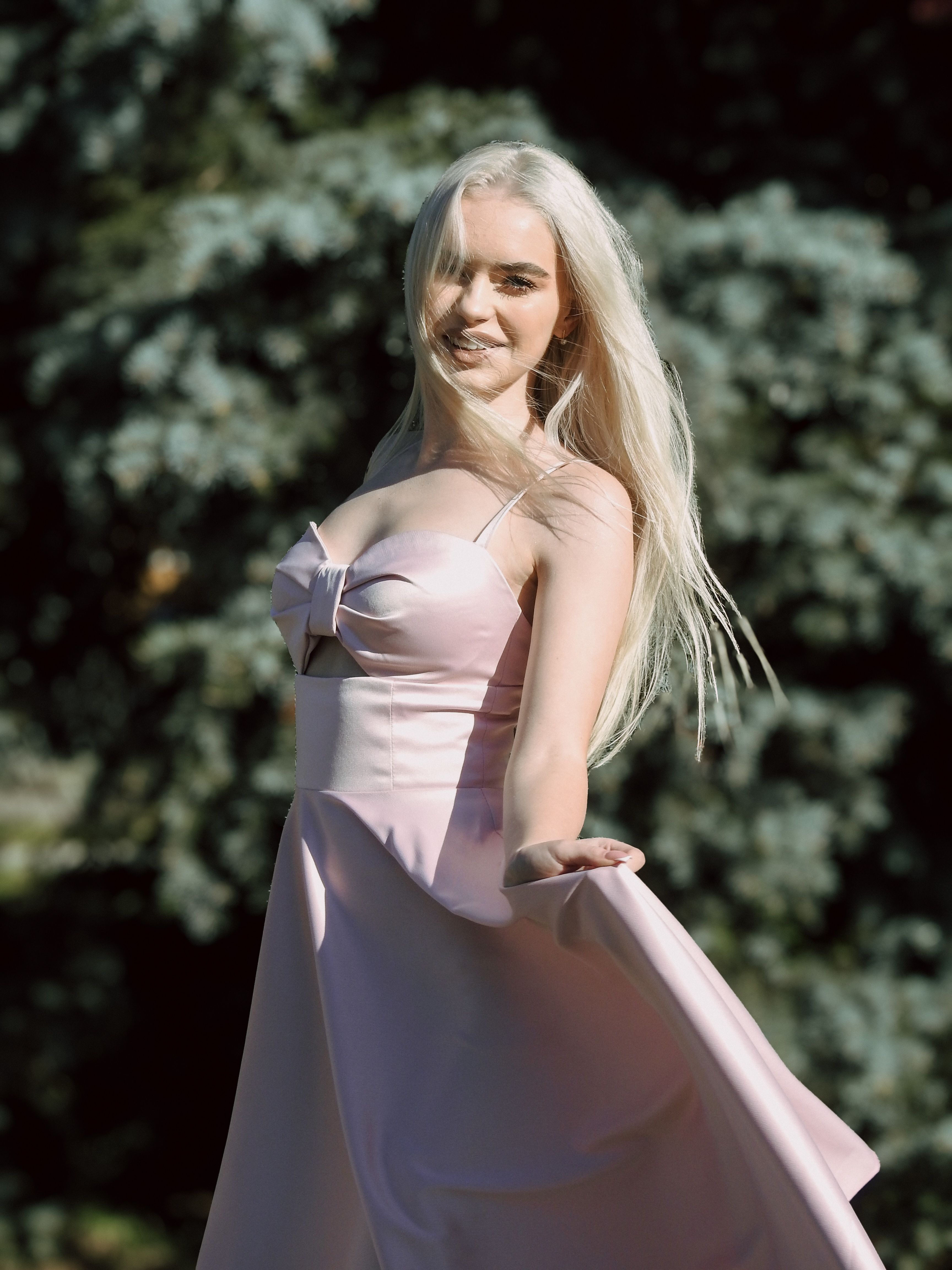Elegant Woman in Pink Dress Outdoors · Free Stock Photo