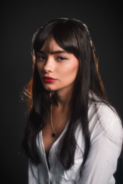 Studio portrait of a woman in soft lighting — photo by Eric Moura on Pexels