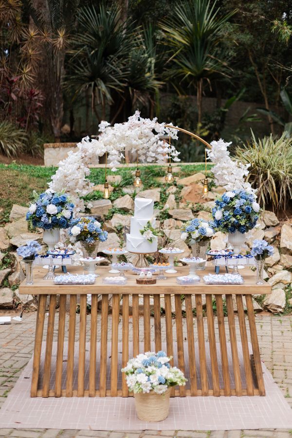Outdoor dessert table decorated with flowers