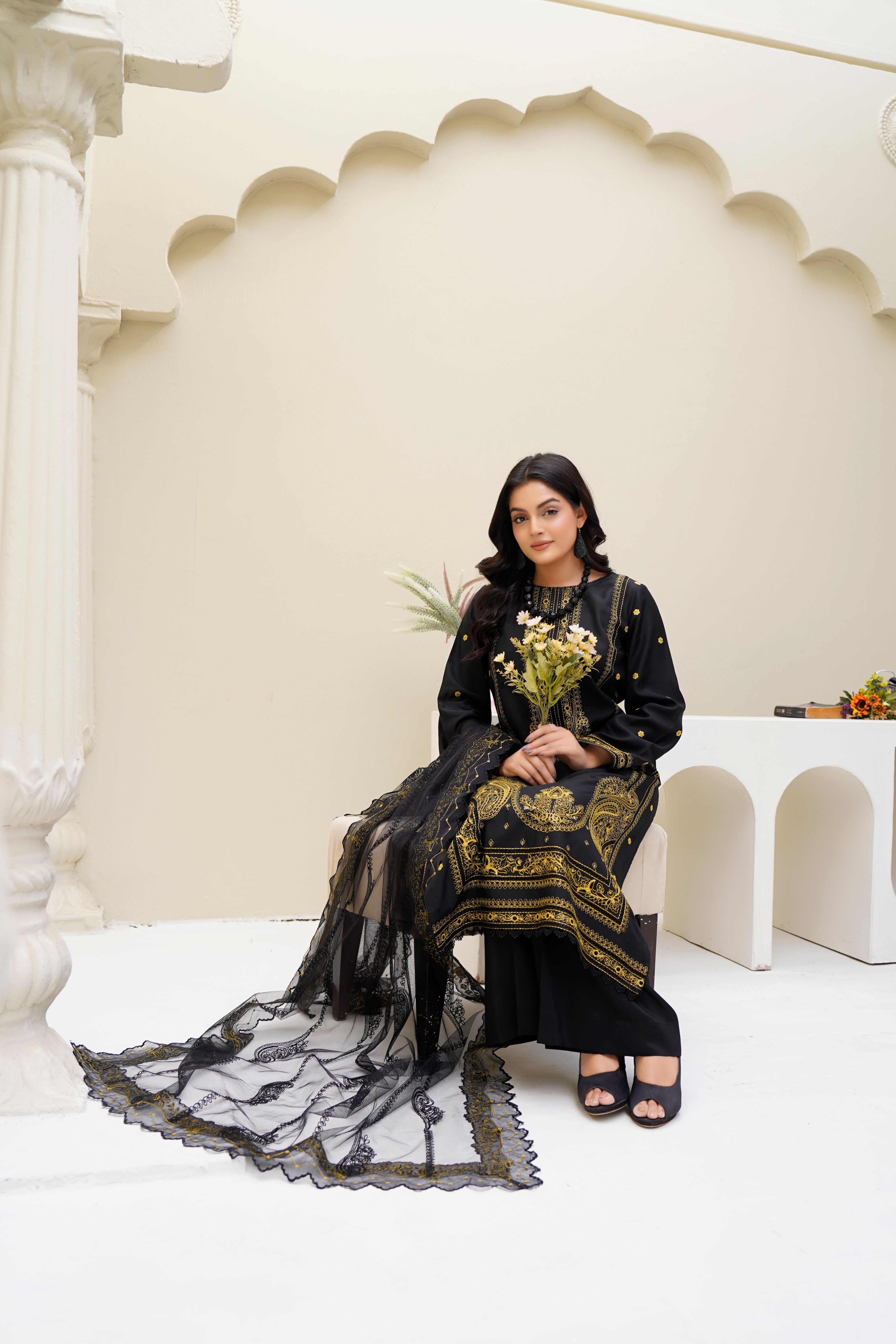 Elegant Woman in Traditional Black Attire Sitting Indoors · Free Stock ...