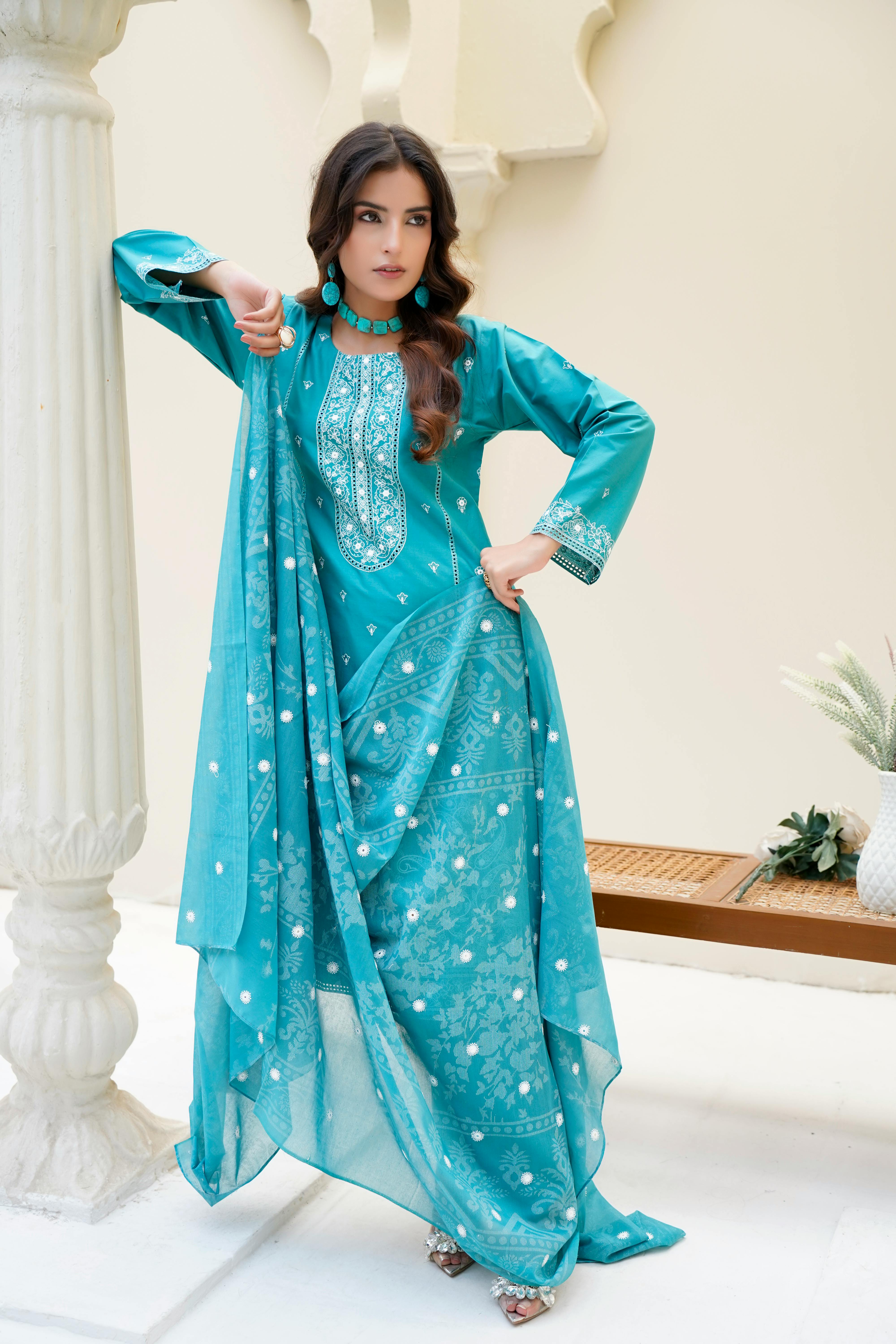 Free Model in vibrant Eastern dress posing indoors with elegance, Lahore. Stock Photo