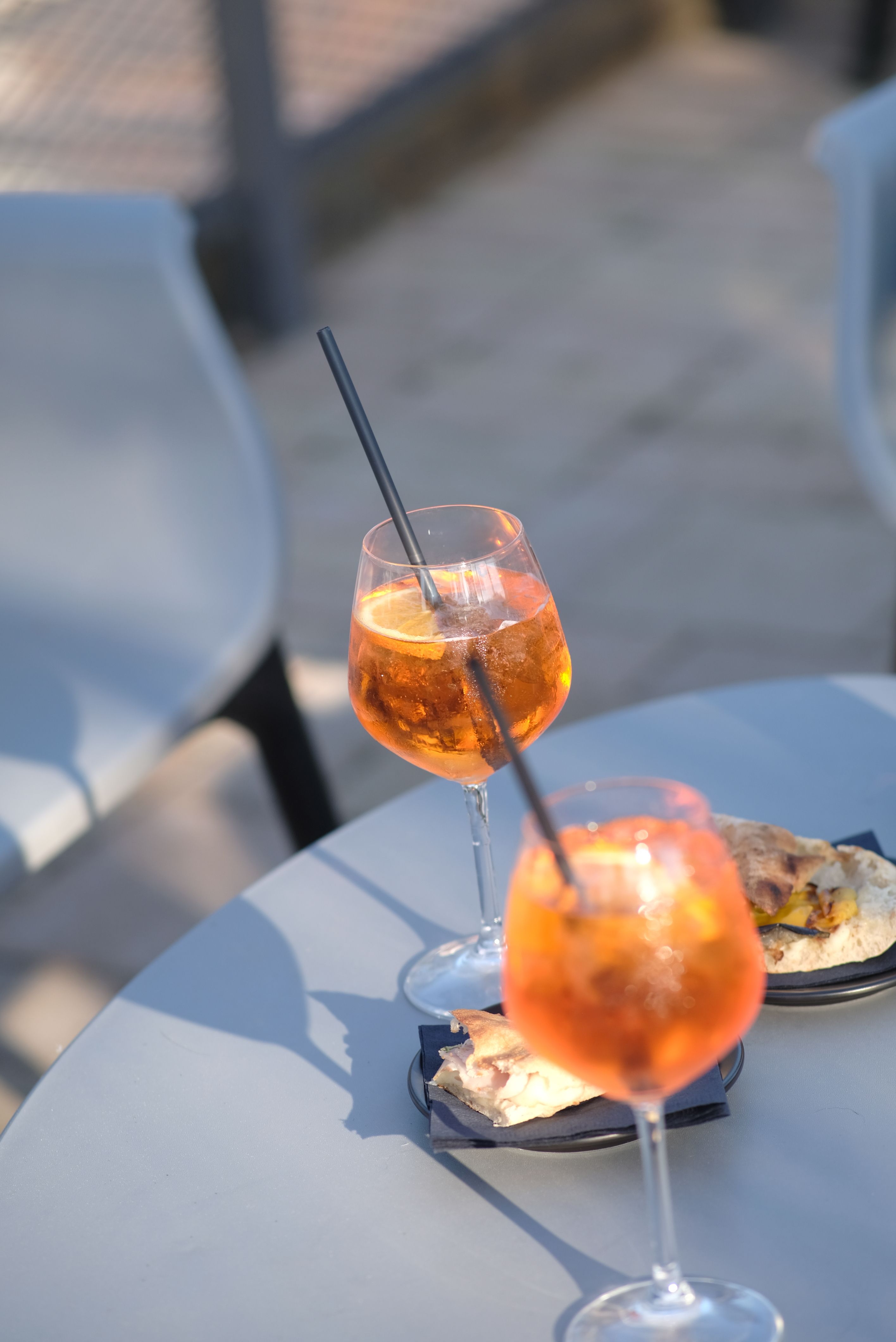 Refreshing Aperol Spritz Cocktails on Outdoor Table · Free Stock Photo
