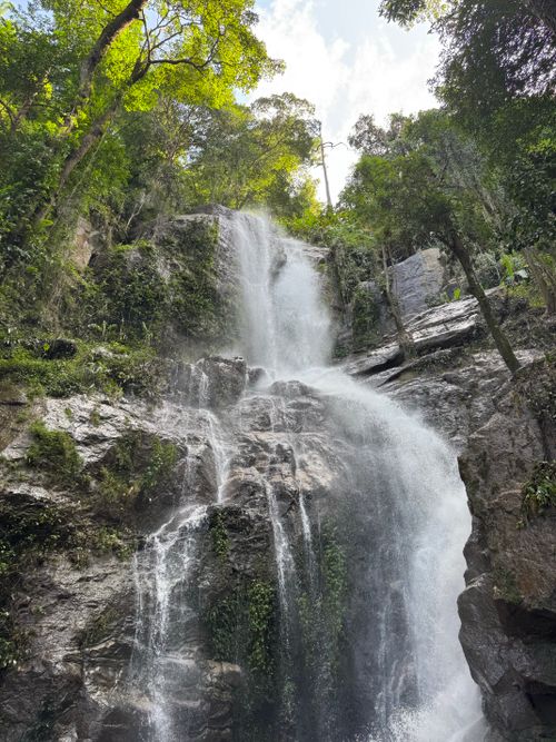 Free Lush waterfall cascading down rocks in Chiang Mai's serene Don Kaeo, Thailand. Stock Photo