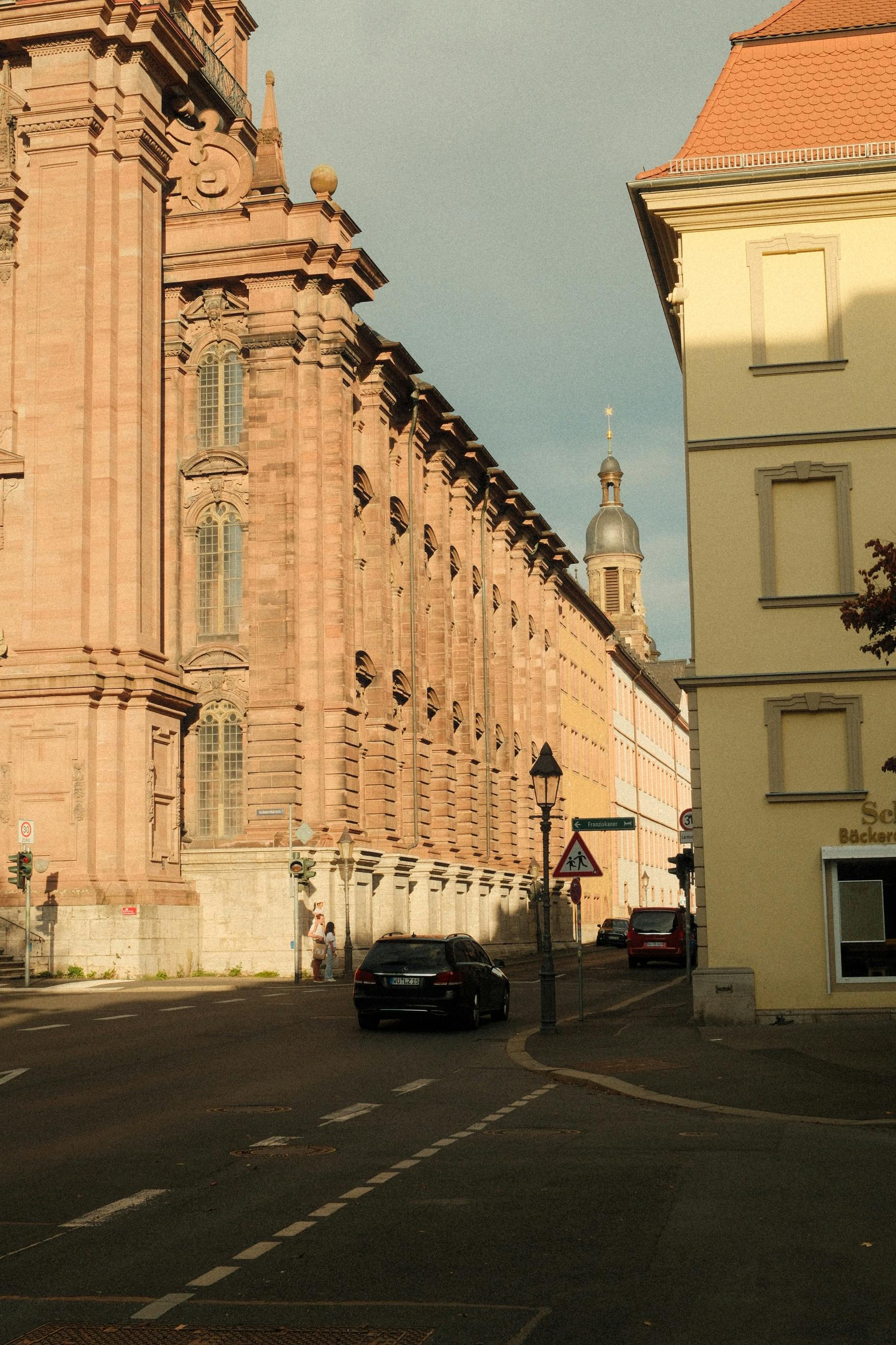 Beautiful street view of historic buildings in Würzburg, Germany, captured during sunset light.