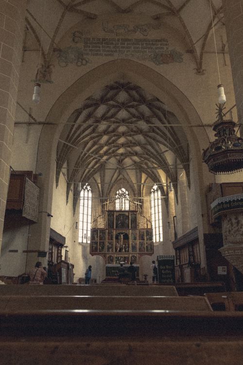 Free Explore the serene and historic beauty of a medieval church interior with intricate architecture. Stock Photo