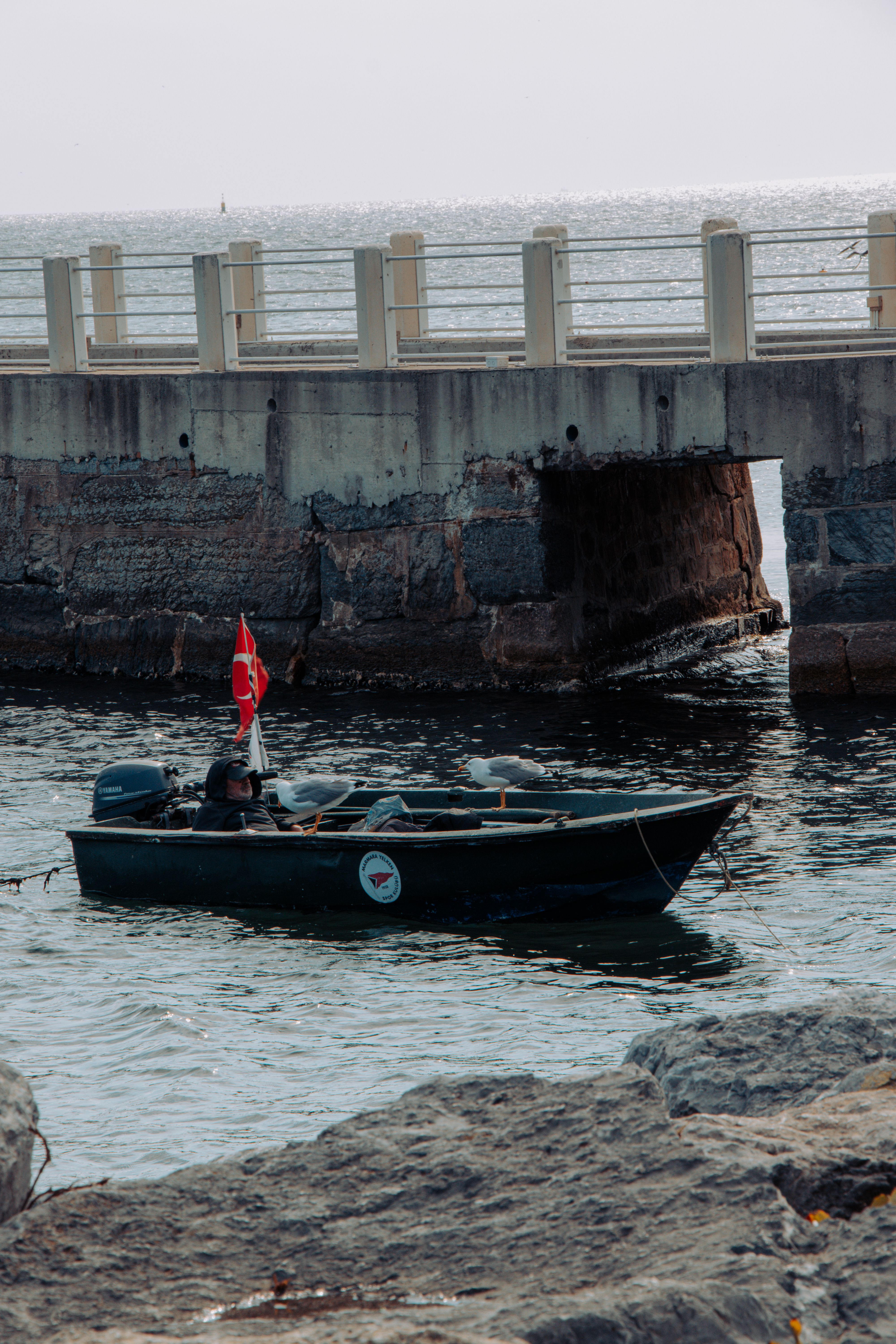 Fishing Boat Under Bridge in İstanbul, Türkiye · Free Stock Photo