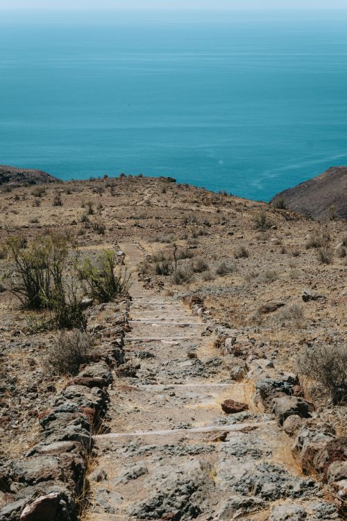 Free Explore a rugged path with ocean views in Alajeró, La Gomera, Spain. Stock Photo