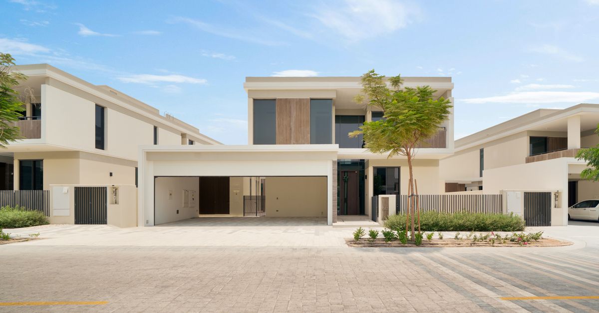 Elegant modern house exterior showcasing spacious garage and architecture.