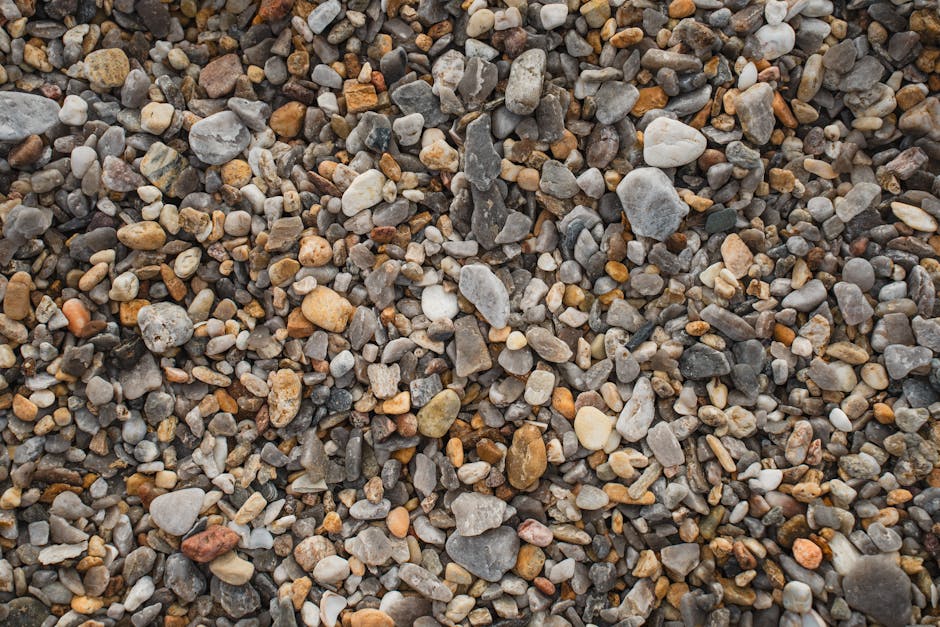 Vibrant close-up of mixed pebbles and stones, ideal for background use.