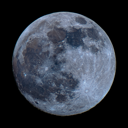 Free Stunning close-up of the full moon showcasing its detailed surface and craters. Stock Photo