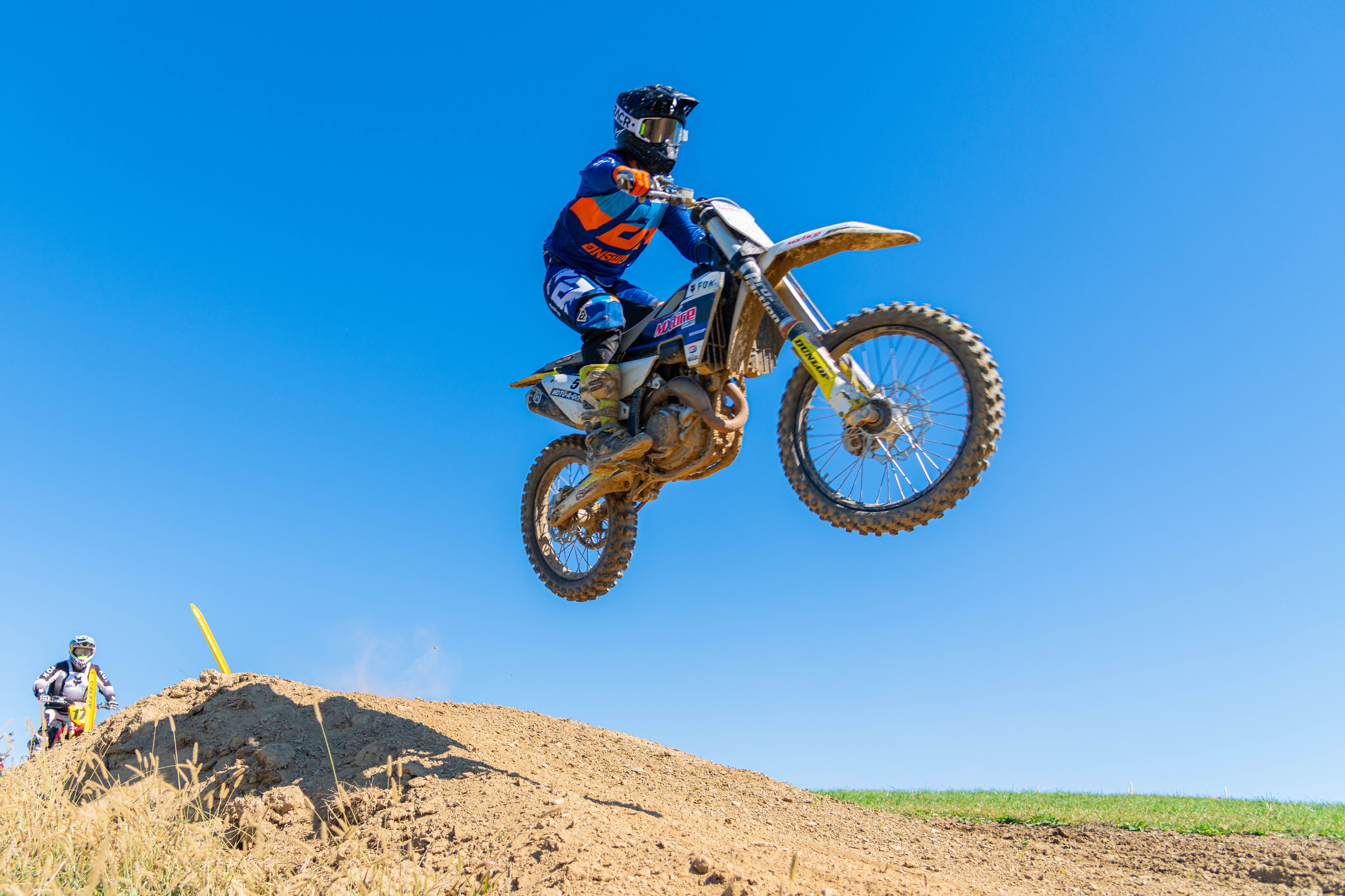 Professional motocross rider jumping high · Free Stock Photo