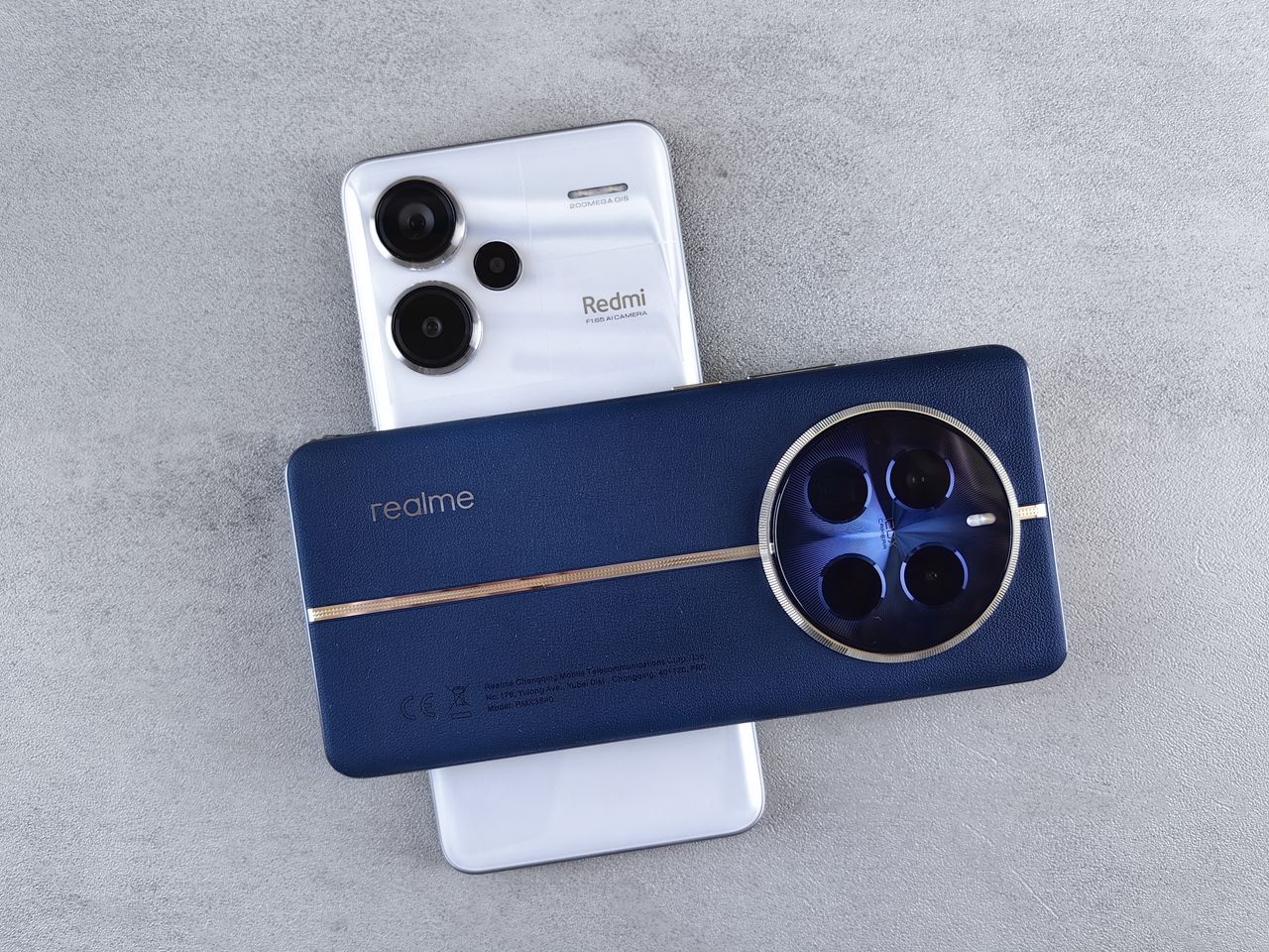 flat lay of two modern smartphones with prominent camera designs on a