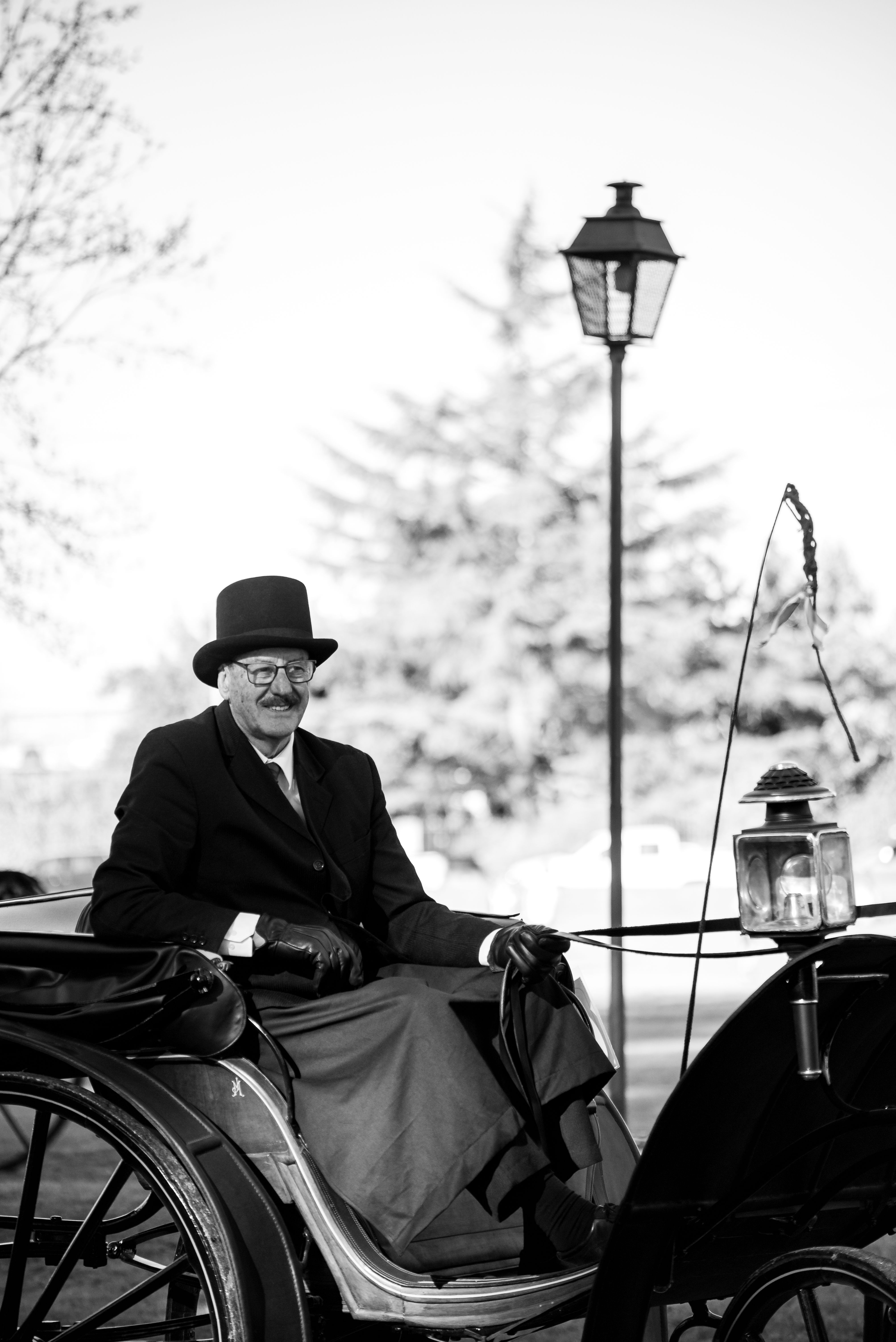 An elderly gentleman enjoys a classic carriage ride in Chascomús, Argentina.