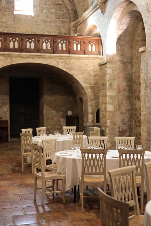 Free Charming rustic dining area in a historic Provençal building in France, capturing the essence of traditional architecture. Stock Photo