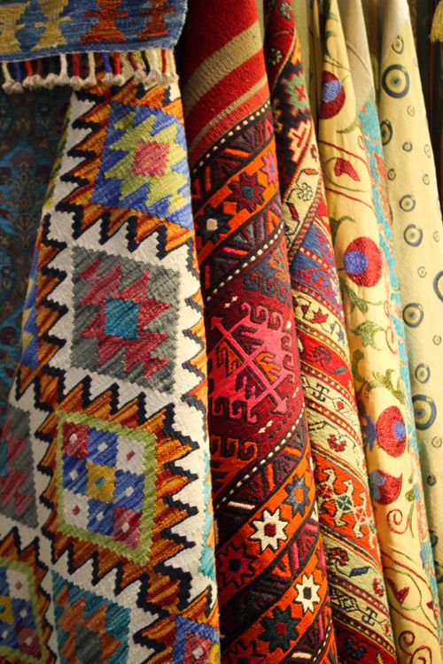 Free A vibrant array of traditional woven textiles showcasing intricate patterns and bold colors. Stock Photo