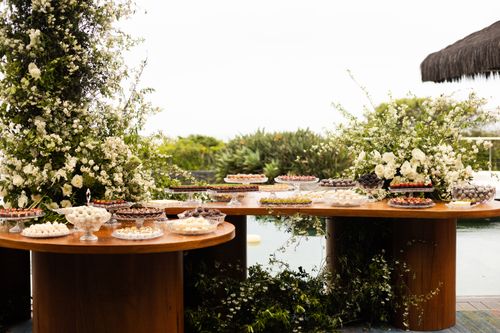 Free Beautiful outdoor wedding setup with floral decor and desserts in Florianópolis, Brazil. Stock Photo