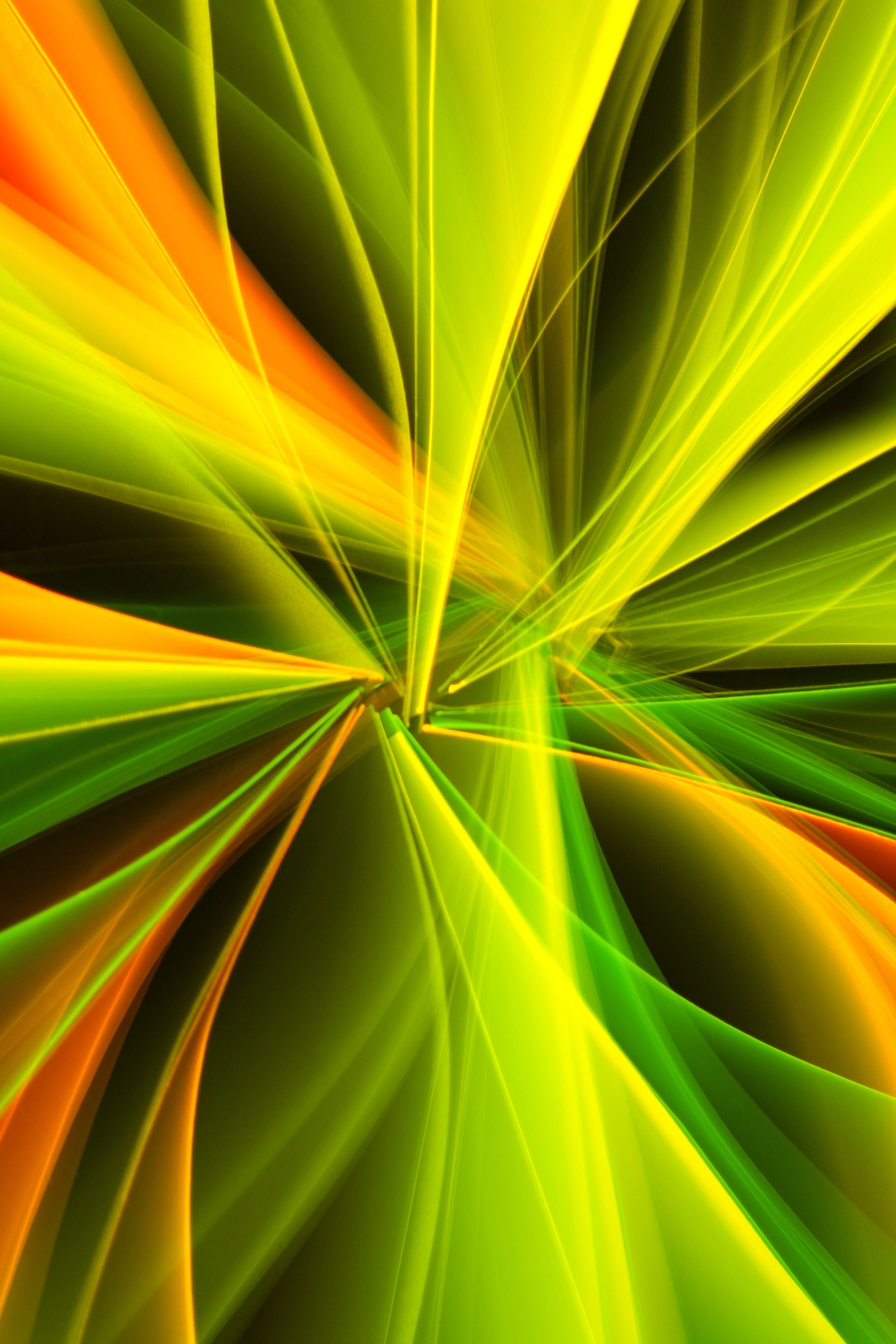 Dynamic abstract design featuring vibrant light streaks in bold green and yellow hues.