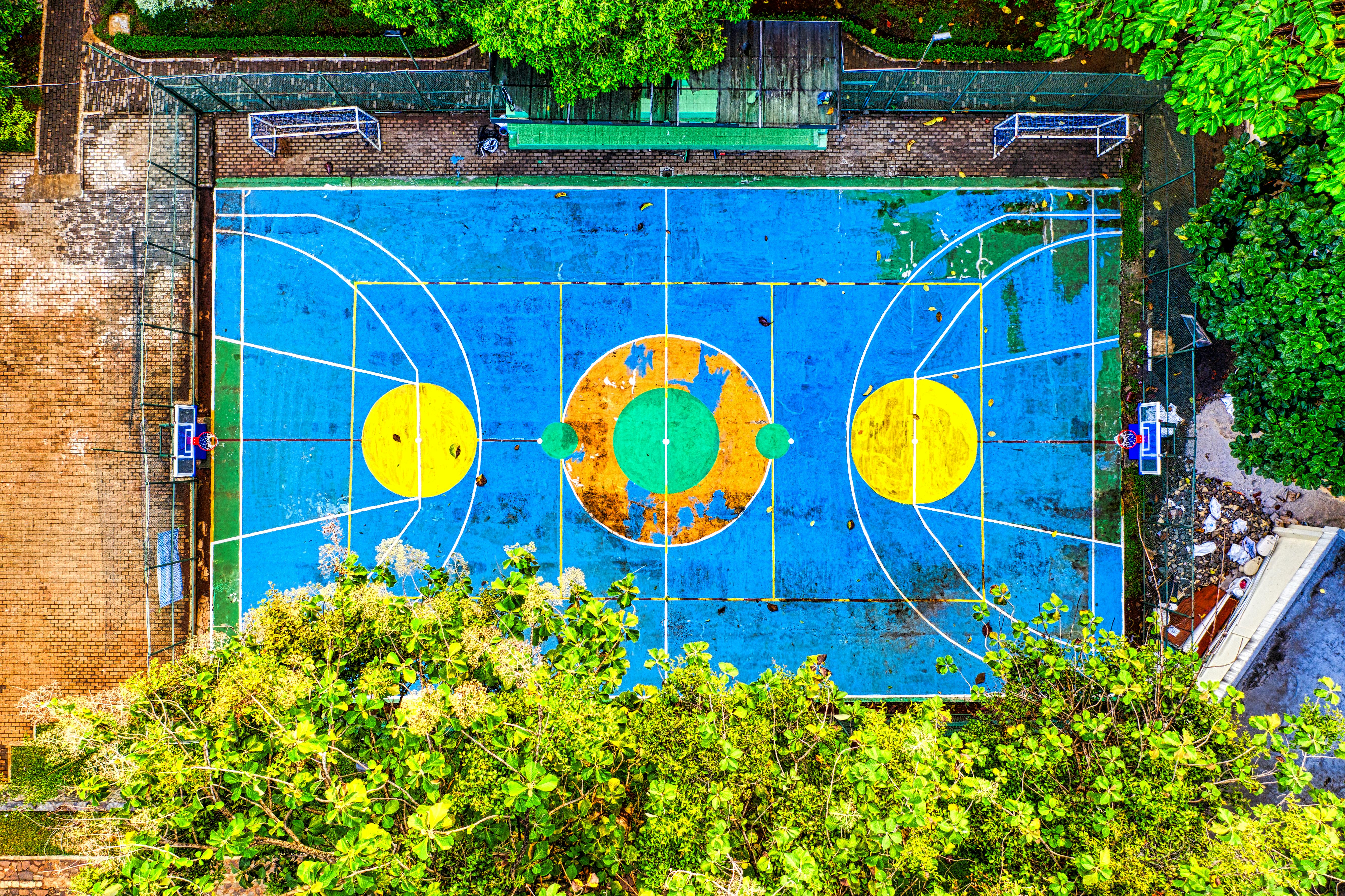 aerial photography of blue and yellow basketball court