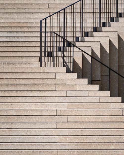 Free Geometric stone staircase with dramatic shadows and minimal design elements. Stock Photo
