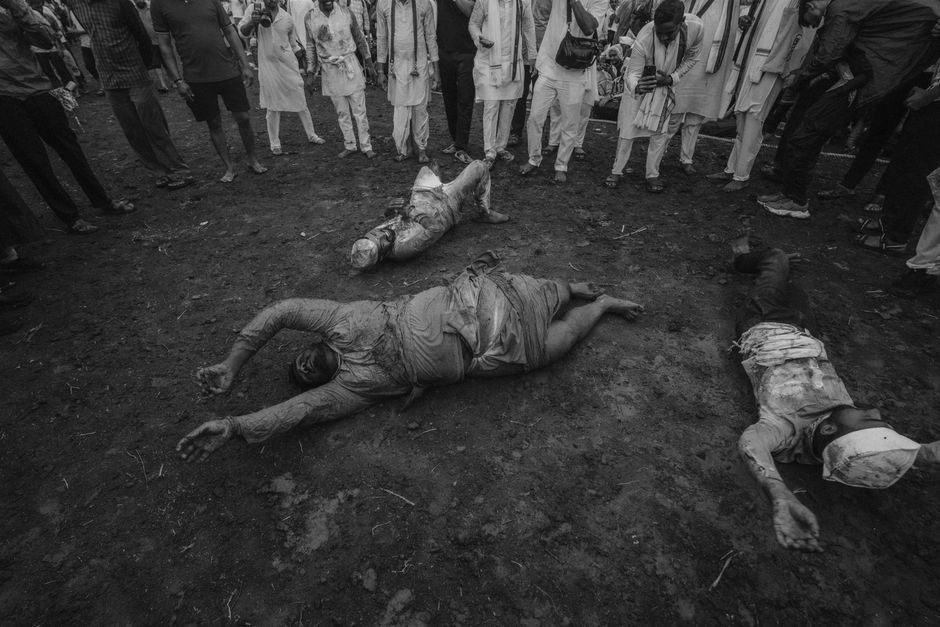 person lying on ground crowd